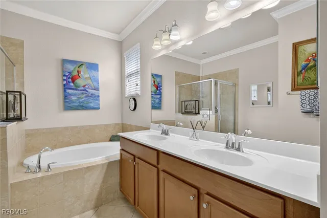 a bathroom with a tub a sink and mirror