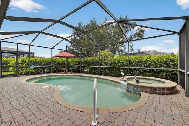 a view of a swimming pool with a patio