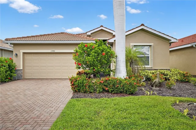 a front view of house with garden