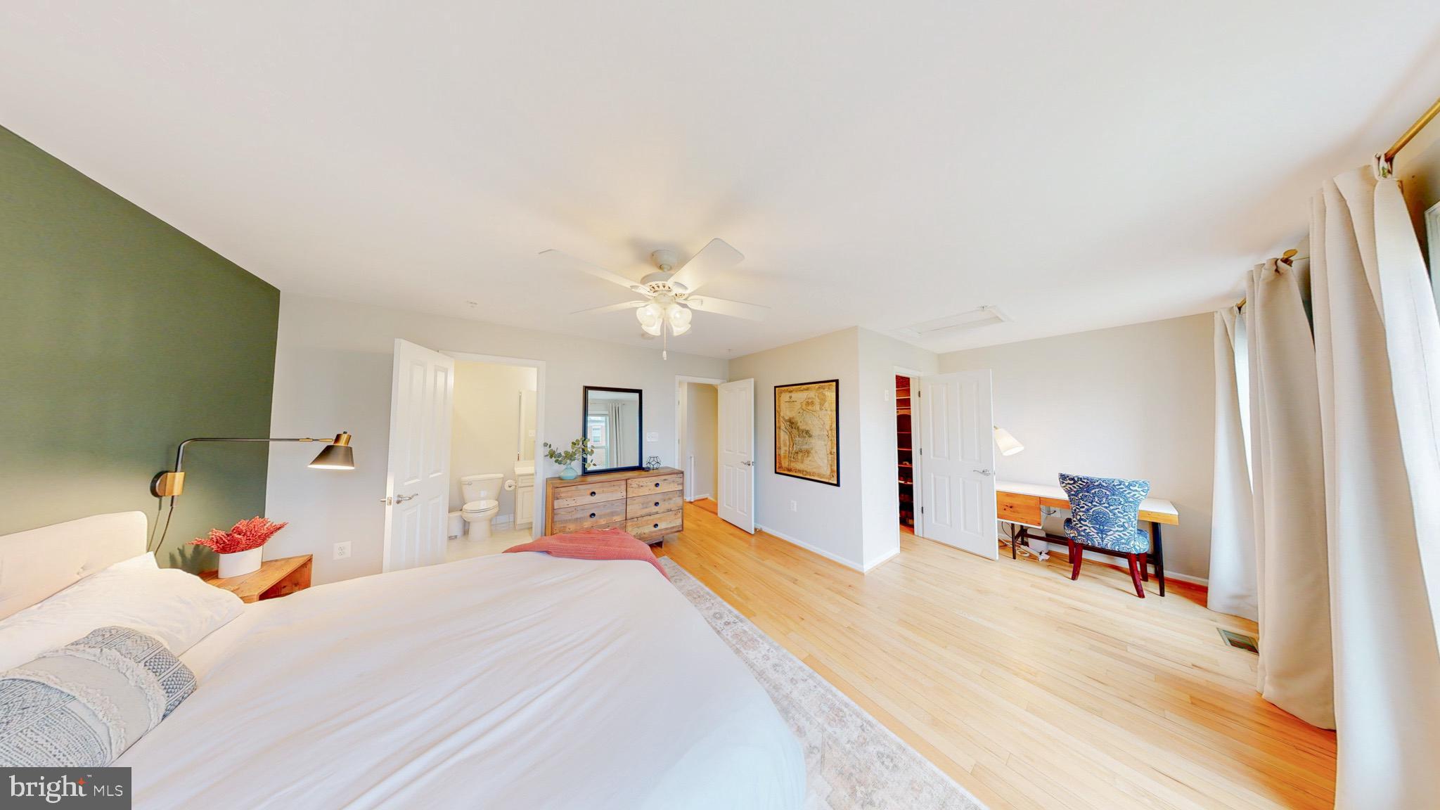 13227 Deer Highlands Way Silver Spring, MD 20906 - Photo 17 of 20 a bed room with a bed and a chair
