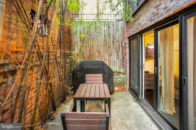 a large bed sitting in a bedroom next to a bathroom