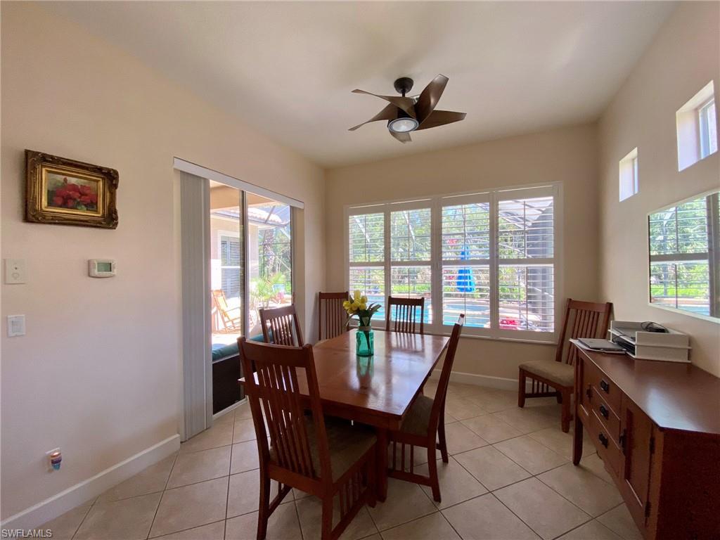 7806 Founders Circle Naples, FL 34104 - Photo 10 of 28 a view of a dining room with furniture window and outside view