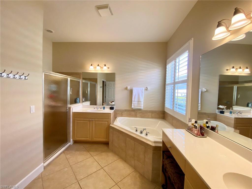 7806 Founders Circle Naples, FL 34104 - Photo 14 of 28 a kitchen with a sink stove and refrigerator