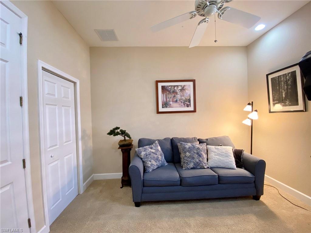 7806 Founders Circle Naples, FL 34104 - Photo 16 of 28 a living room with furniture and a ceiling fan