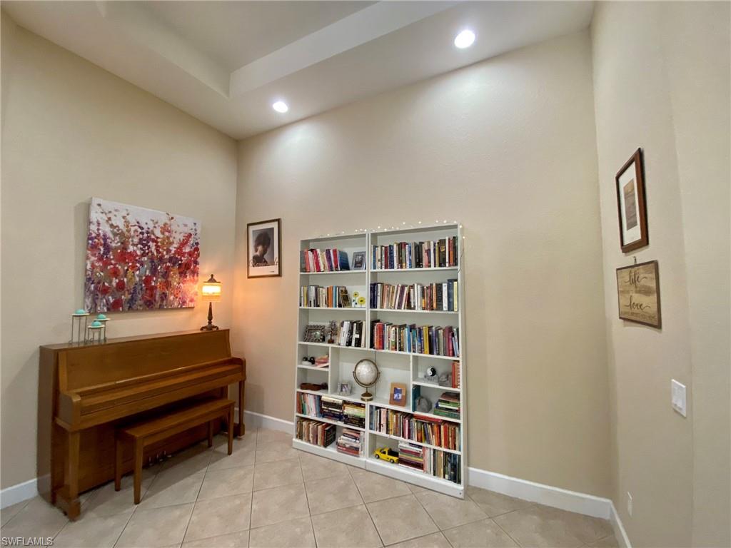 7806 Founders Circle Naples, FL 34104 - Photo 20 of 28 a view of a livingroom with shelves