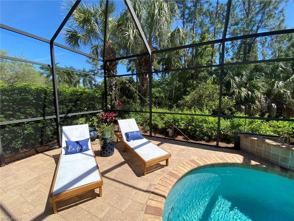 7806 Founders Circle Naples, FL 34104 - Photo 25 of 28 a view of swimming pool with a patio