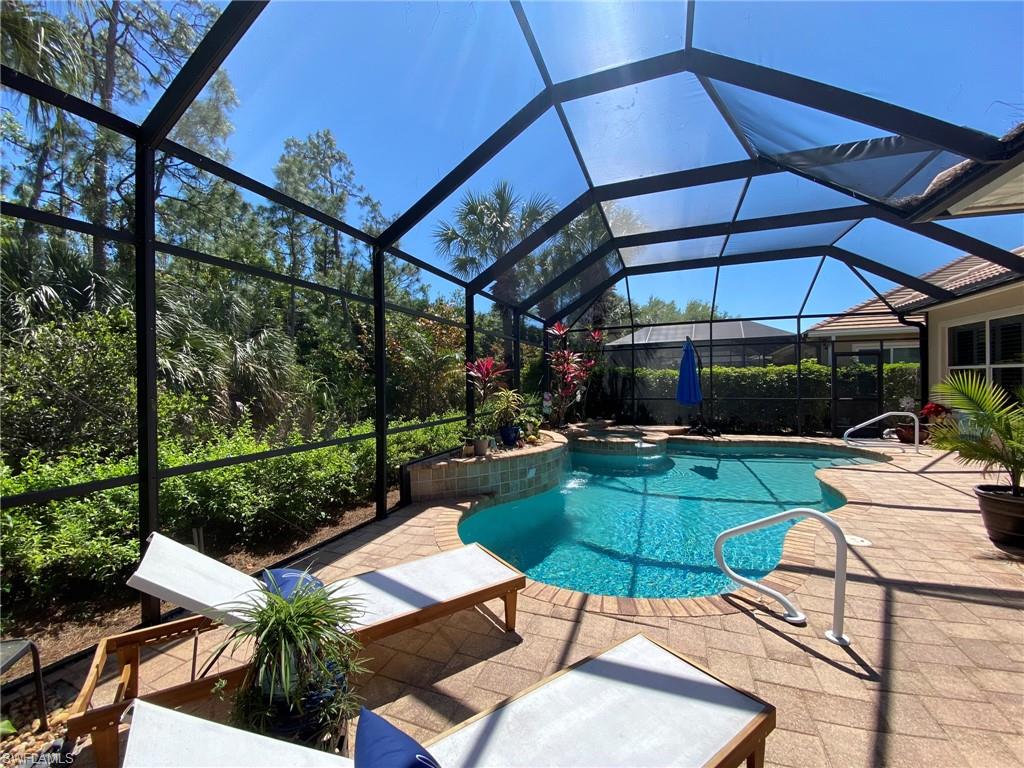 7806 Founders Circle Naples, FL 34104 - Photo 26 of 28 a view of a backyard with sitting area