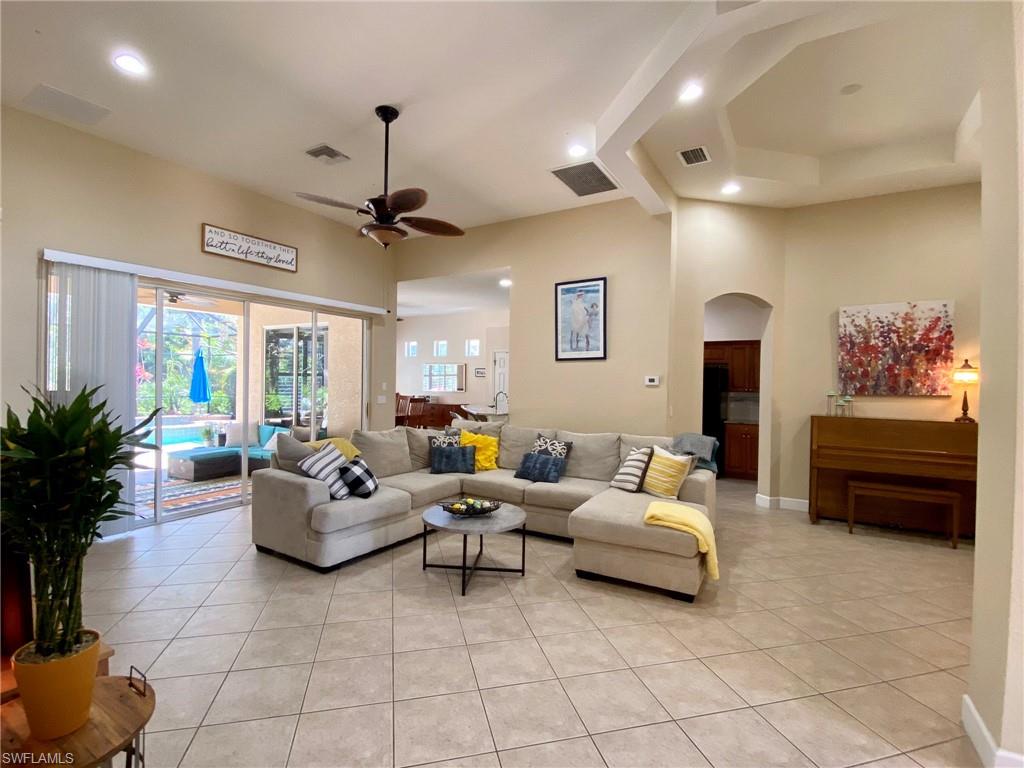 7806 Founders Circle Naples, FL 34104 - Photo 28 of 28 a living room with furniture and a ceiling fan