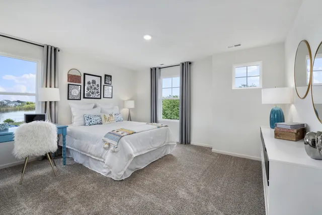 a bedroom with a bed and a couch