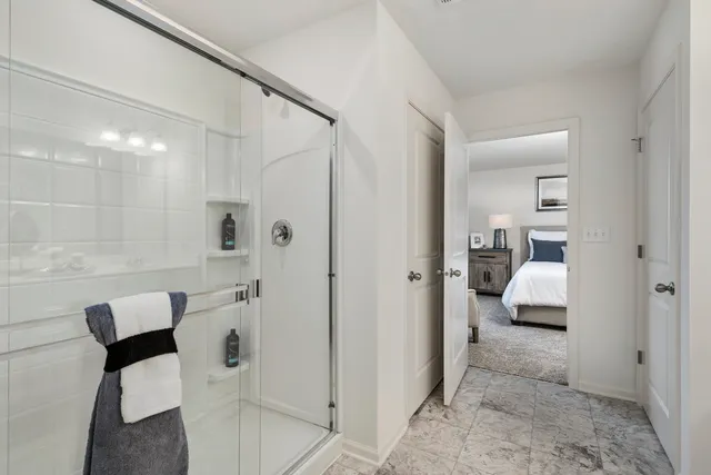 a en suite bathroom with a toilet a sink and mirror