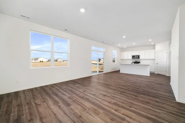a view of kitchen with wooden floor