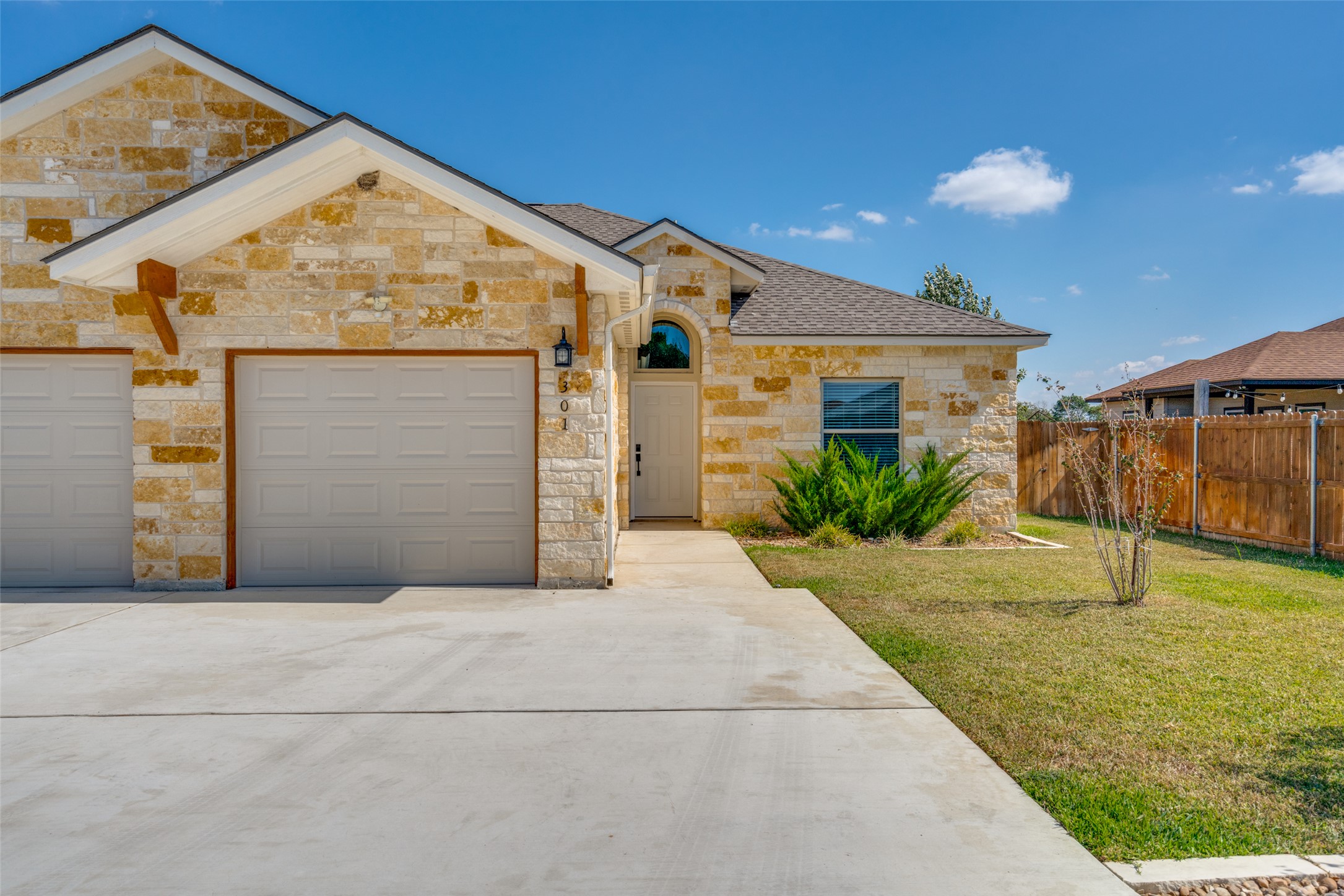 301 Navarro Way, Unit 29B Seguin, TX 78155 - Photo 1 of 26 a front view of a house with a yard