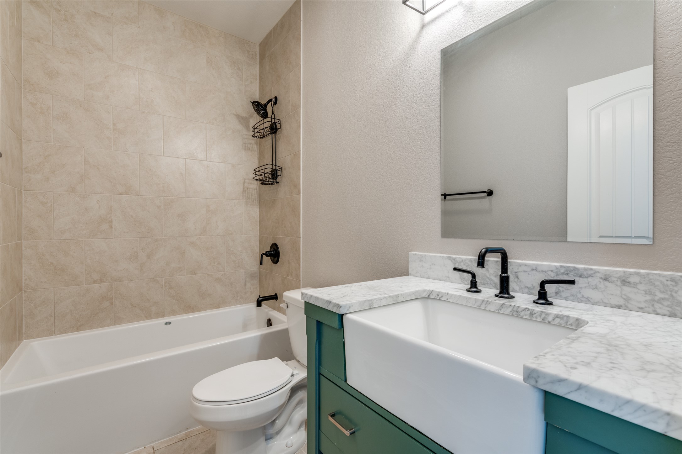 301 Navarro Way, Unit 29B Seguin, TX 78155 - Photo 17 of 26 a bathroom with a granite countertop sink toilet and shower