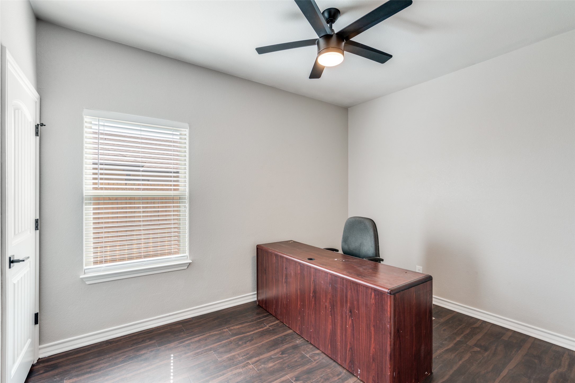 301 Navarro Way, Unit 29B Seguin, TX 78155 - Photo 18 of 26 a bedroom with bed and wooden floor