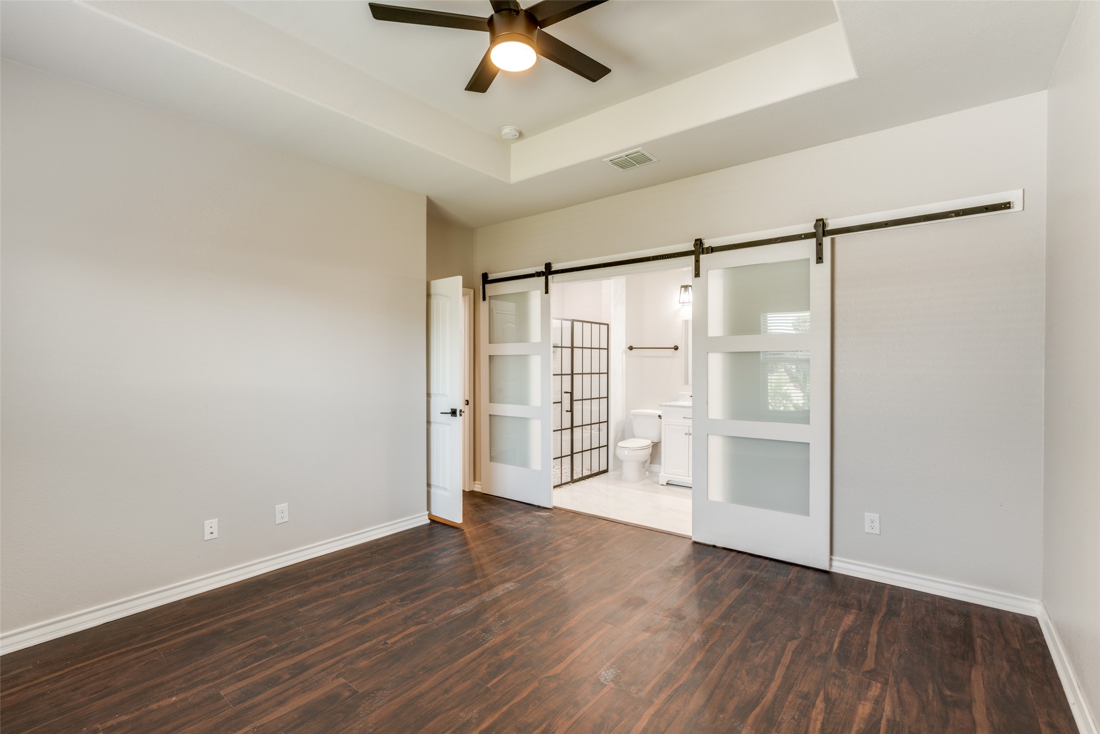 301 Navarro Way, Unit 29B Seguin, TX 78155 - Photo 6 of 26 a view of an empty room with wooden floor