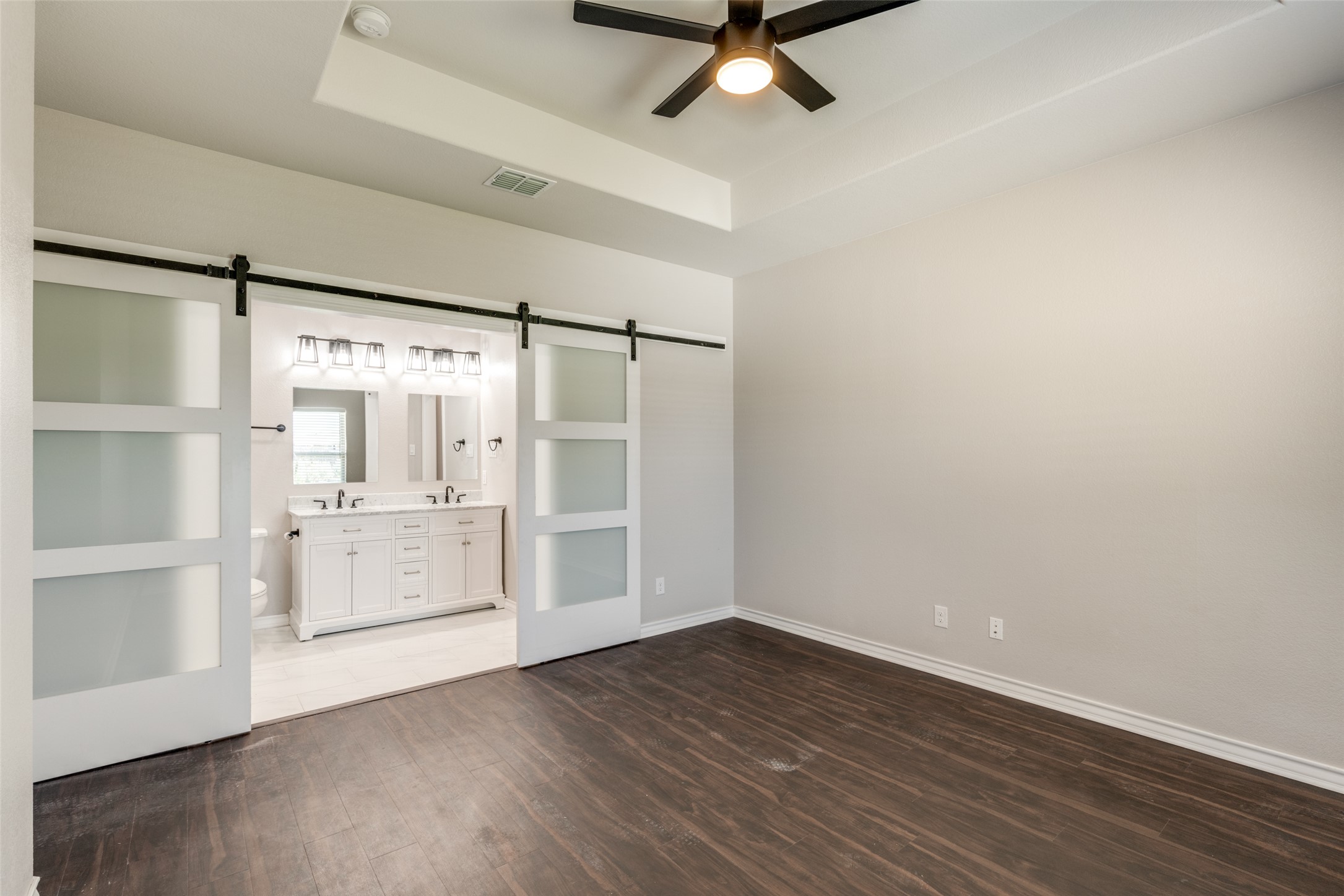 301 Navarro Way, Unit 29B Seguin, TX 78155 - Photo 9 of 26 wooden floor in an empty room