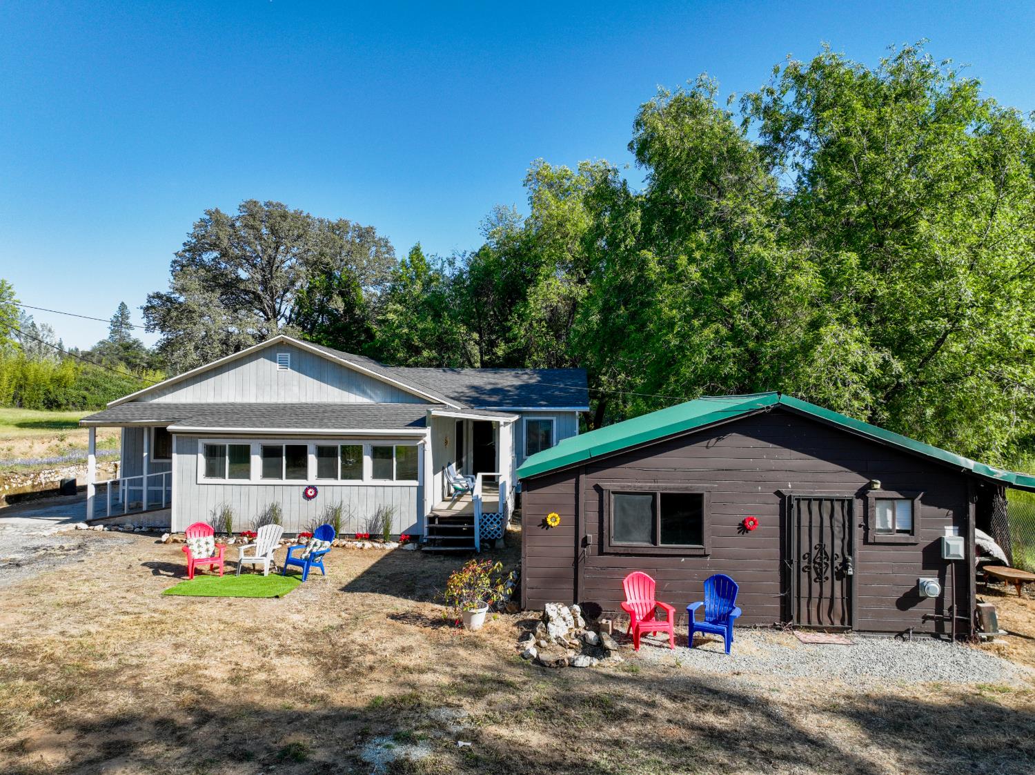 13351 Newtown Road Nevada City, CA 95959 - Photo 2 of 50 a view of a house with a yard and sitting area