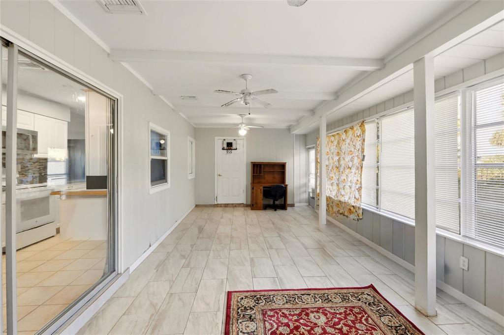 301 Lambert Street Port Charlotte, FL 33948 - Photo 18 of 30 a view of an entryway with wooden floor and a living room