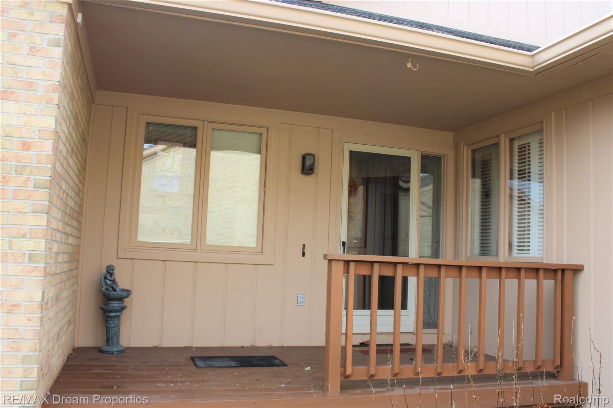 21975 River Ridge Trail Farmington, MI 48335 - Photo 3 of 22 front deck entrance.jpg