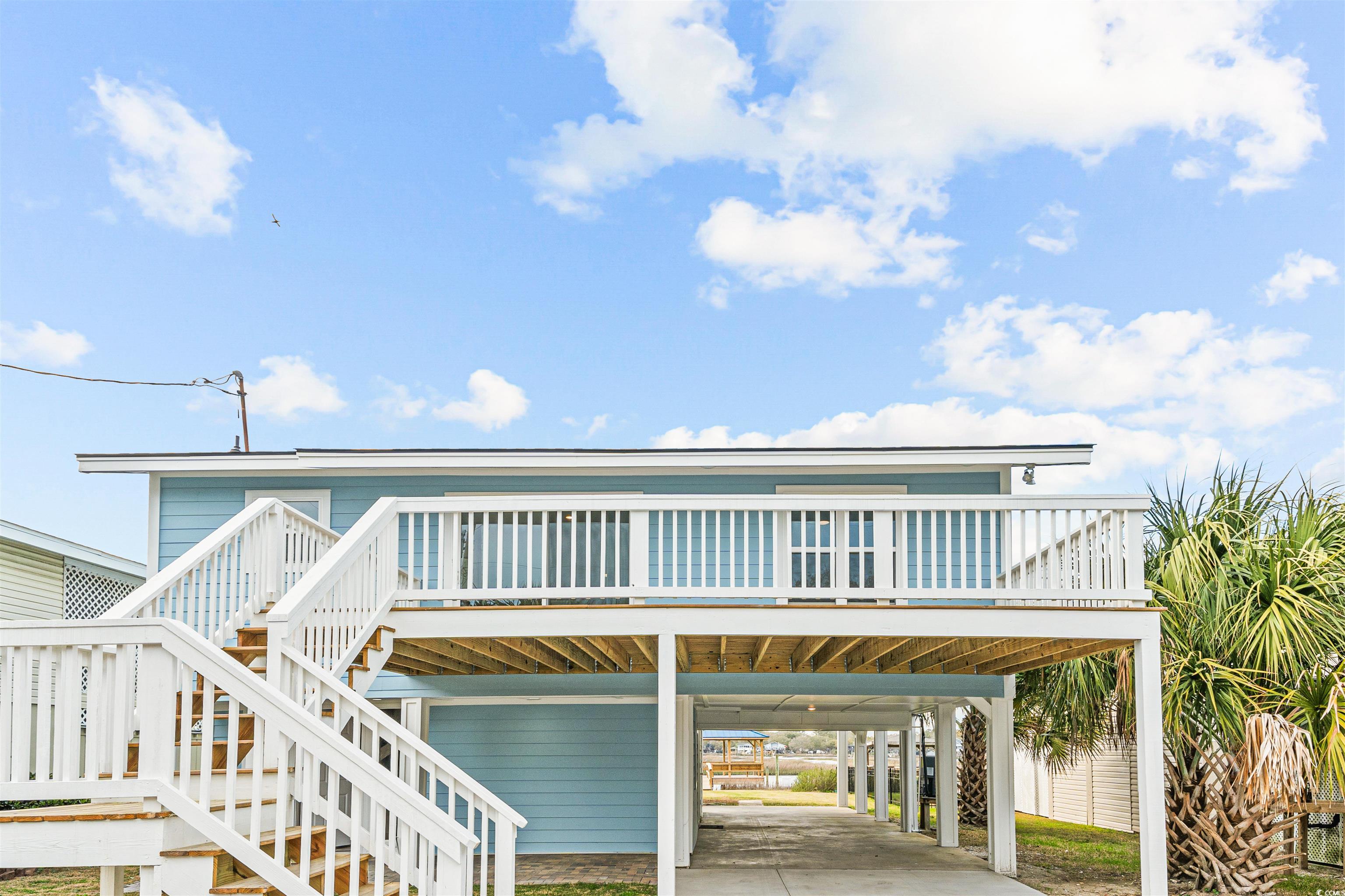 338 State Rd S-26-530 Murrells Inlet, SC 29576 - Photo 33 of 39 View of front of property with stairs and a carport