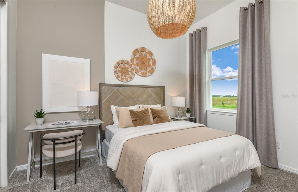 1947 Spring Shower Circle Kissimmee, FL 34744 - Photo 15 of 18 a bedroom with a bed and a window