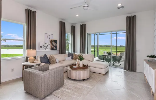 a living room with furniture and a large window