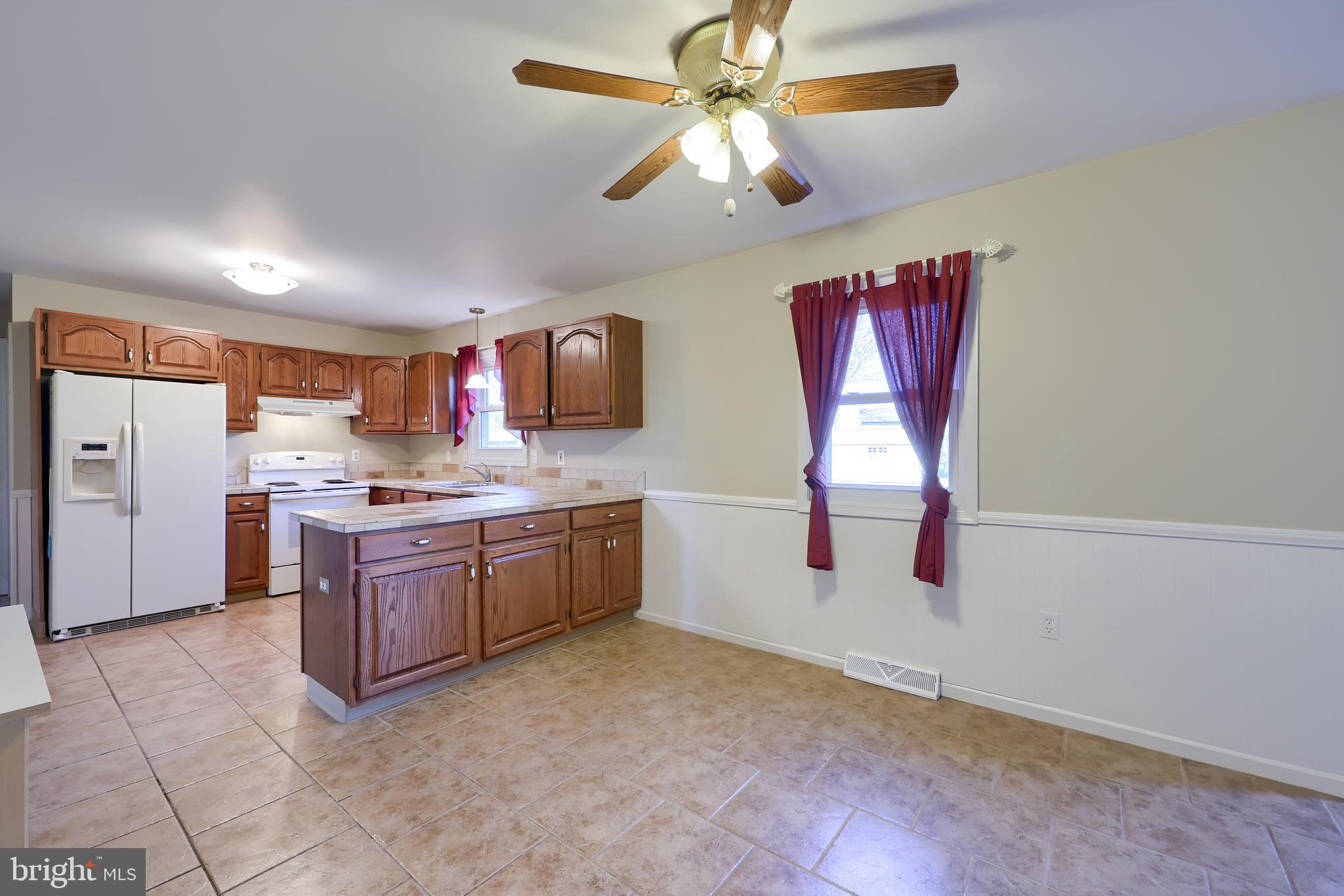 746 West 6th Street Lititz, PA 17543 - Photo 14 of 43 a kitchen with stainless steel appliances granite countertop a sink cabinets and window