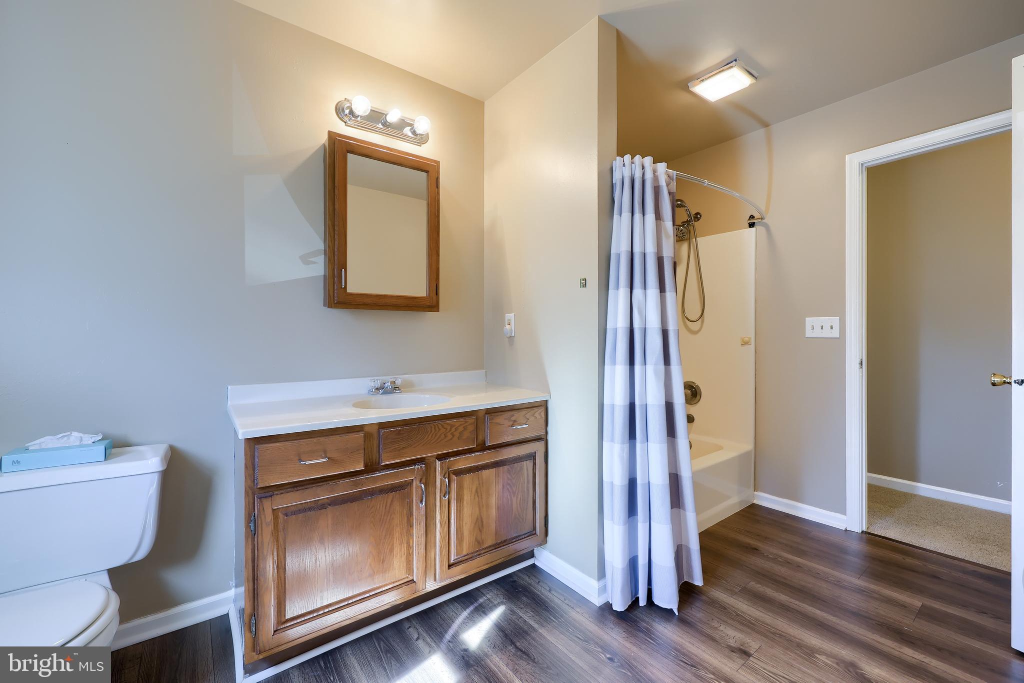 746 West 6th Street Lititz, PA 17543 - Photo 27 of 43 a bathroom with a sink a toilet and mirror