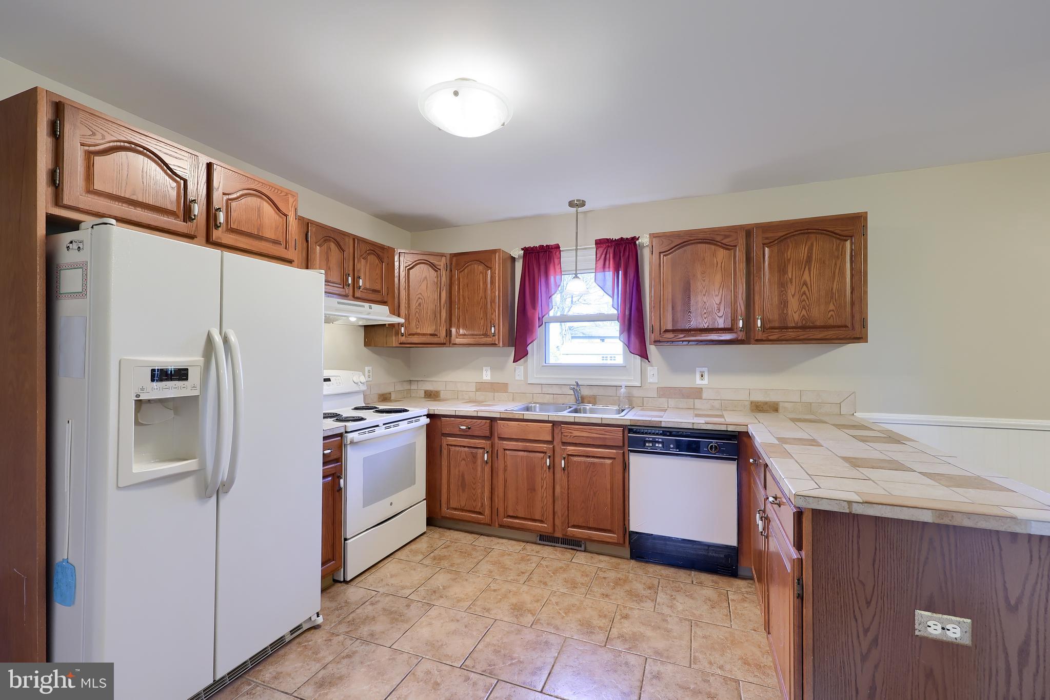 746 West 6th Street Lititz, PA 17543 - Photo 8 of 43 a kitchen with stainless steel appliances granite countertop a sink stove and refrigerator