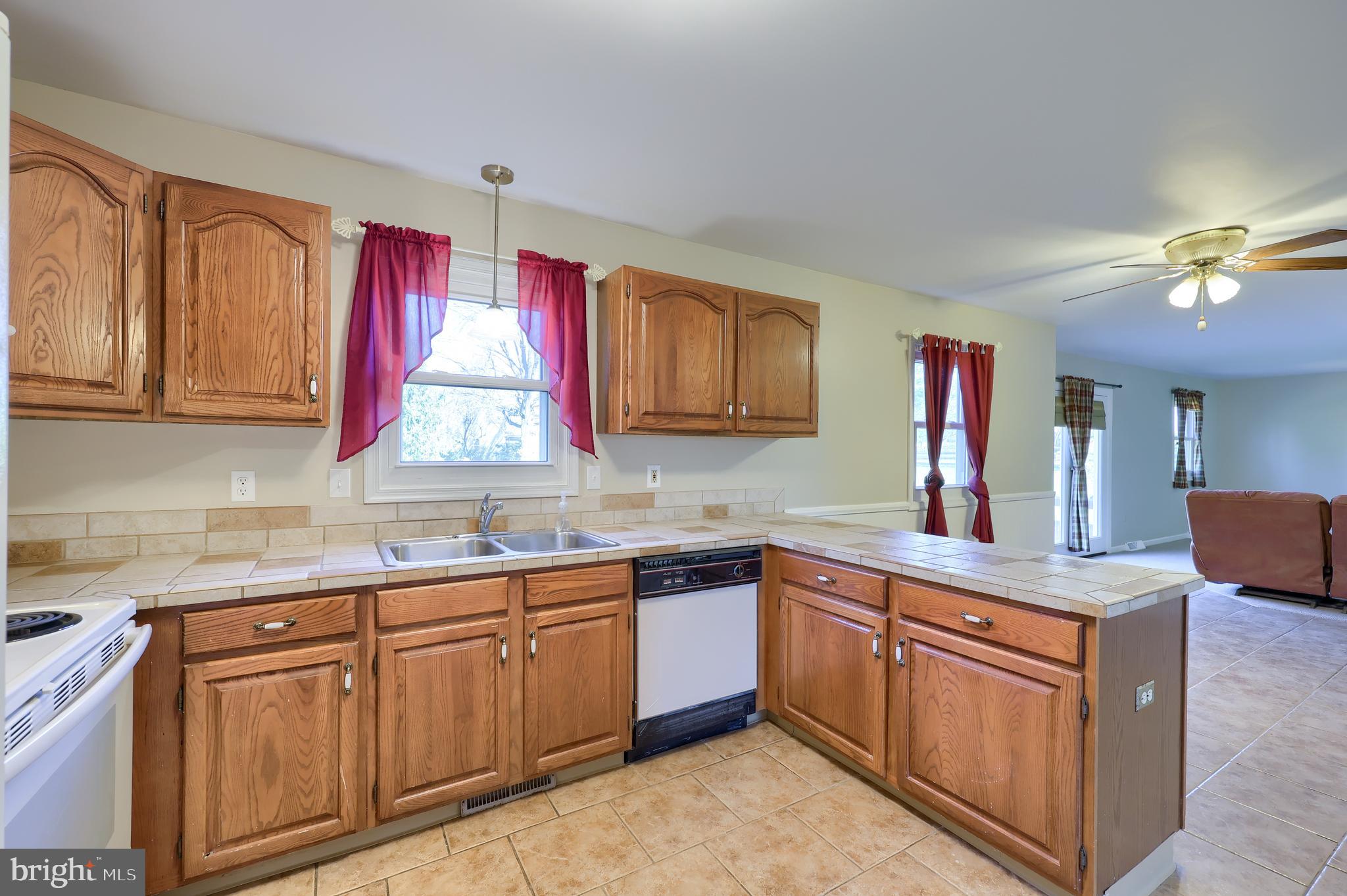 746 West 6th Street Lititz, PA 17543 - Photo 9 of 43 a kitchen with cabinets appliances a sink and a counter top space