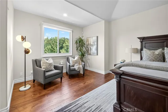 a large white kitchen with a large window