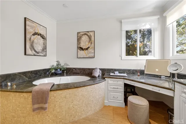 a spacious bathroom with a tub and shower