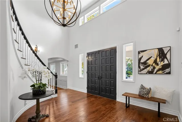 a view of an entryway with wooden floor