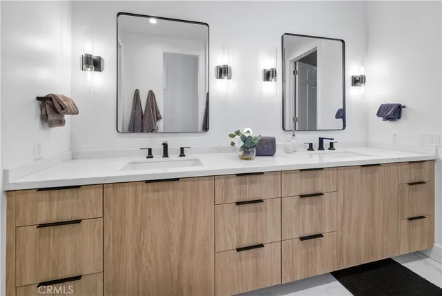 a bedroom with a large bed and a table