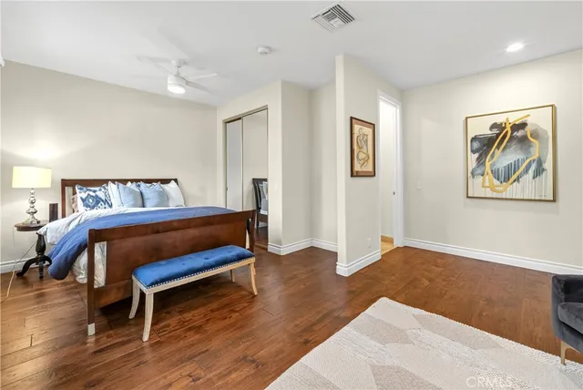 a bathroom with a double vanity sink toilet and shower