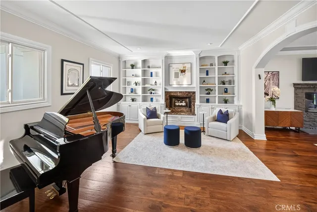 a living room with furniture a rug and a fireplace