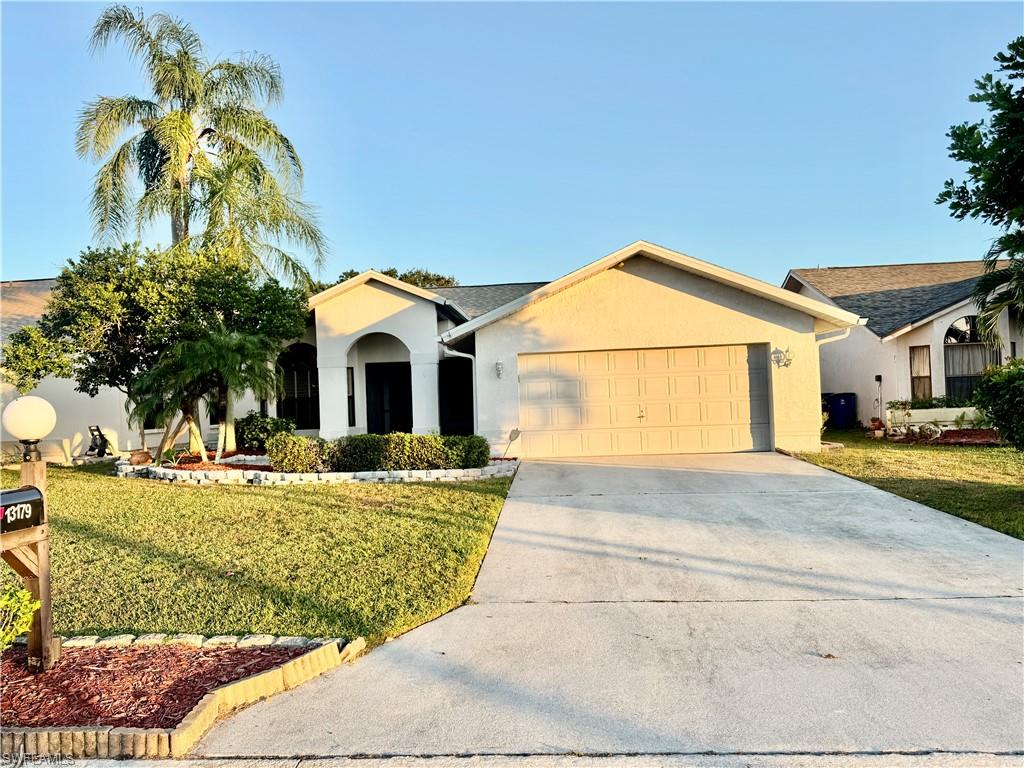 a view of swimming pool with a yard and plants