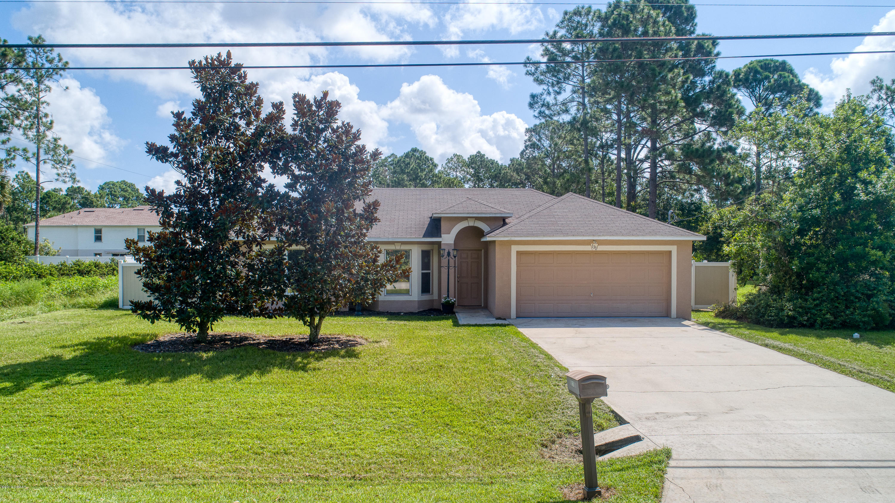 131 Rae Drive Palm Coast, FL 32164 - Photo 1 of 32 131RaeDrive_Drone-1