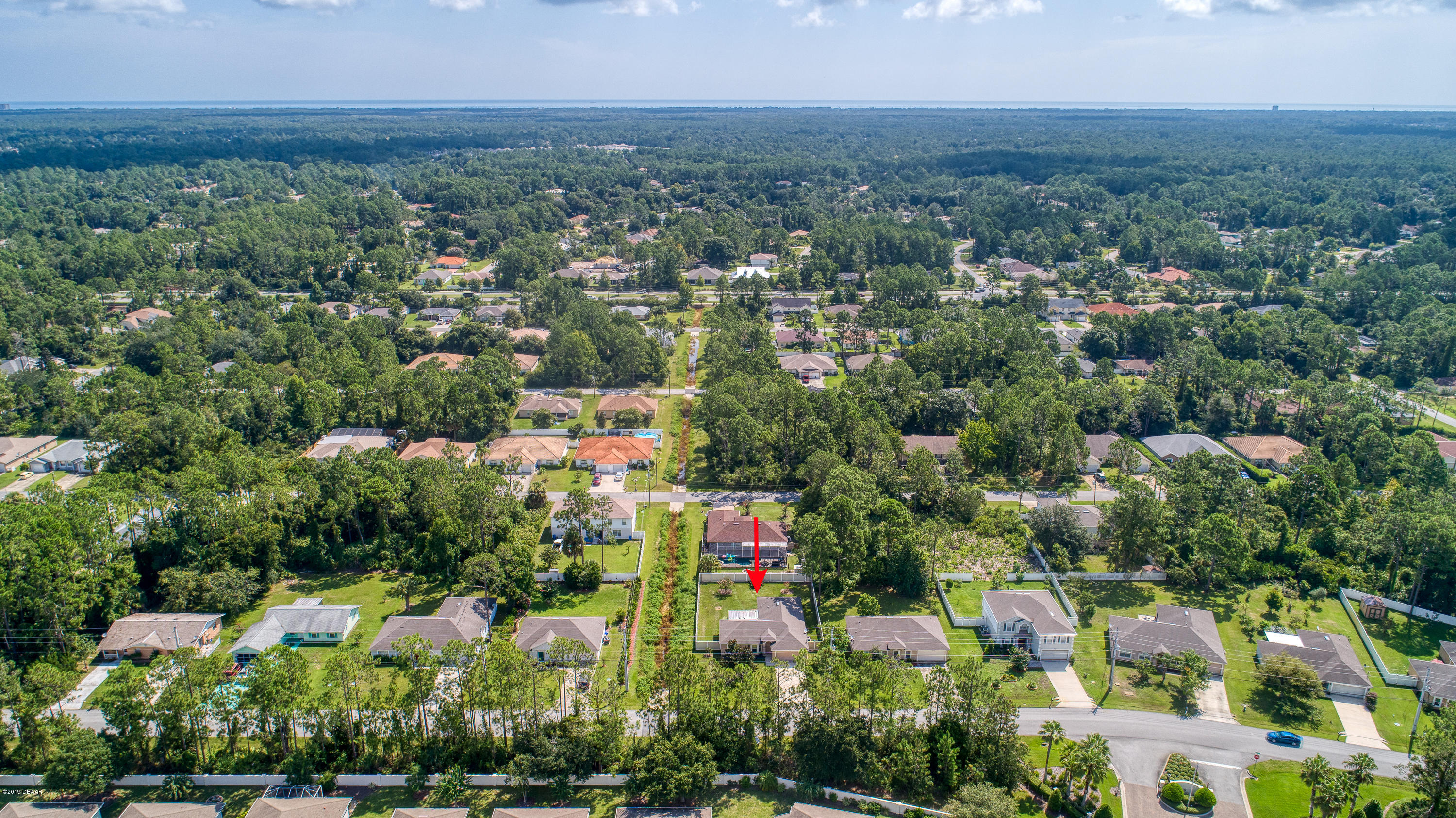 131 Rae Drive Palm Coast, FL 32164 - Photo 3 of 32 131RaeDrive_Drone-4_arrow