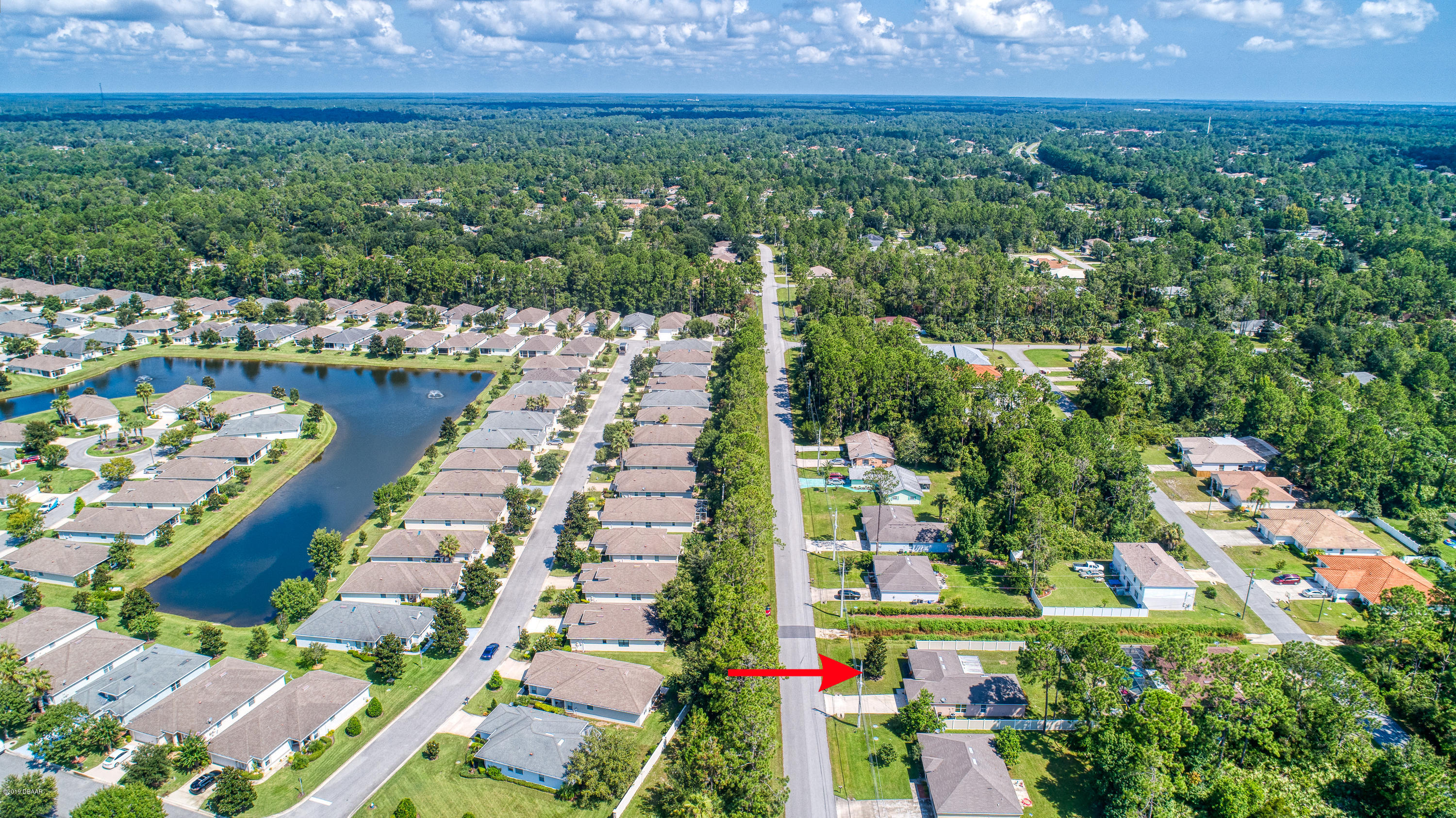 131 Rae Drive Palm Coast, FL 32164 - Photo 4 of 32 131RaeDrive_Drone-5_arrow