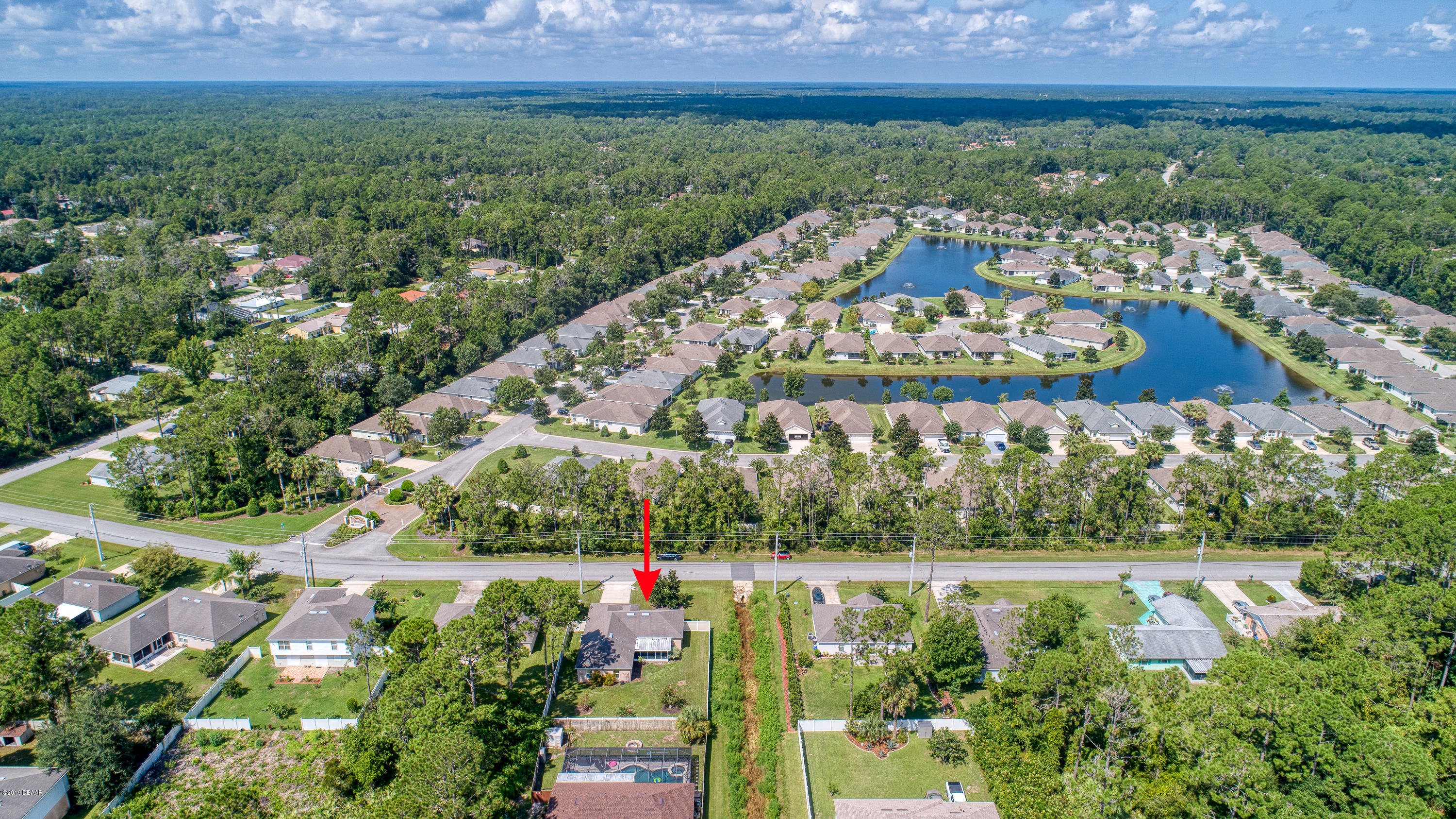 131 Rae Drive Palm Coast, FL 32164 - Photo 7 of 32 131RaeDrive_Drone-7_arrow