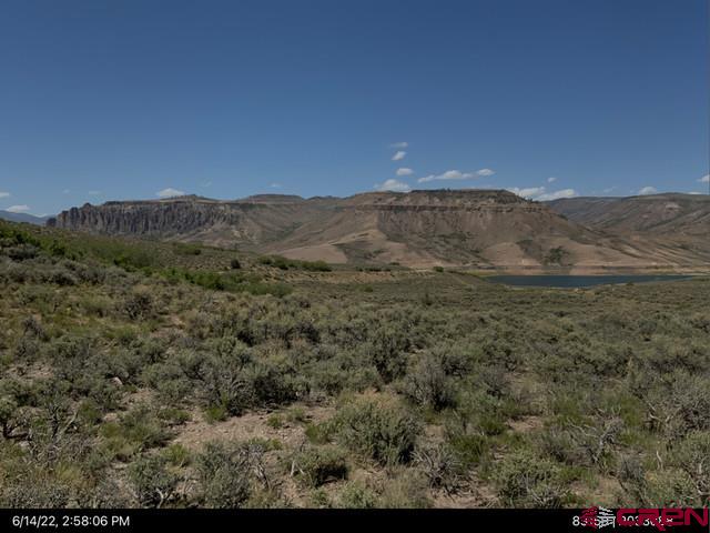 26 - Lake Gunnison, CO 81230 - Photo 10 of 17 a view of a mountain range with trees in the background