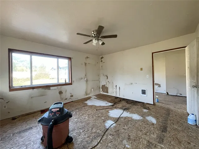 a view of a livingroom with furniture window and wooden floor