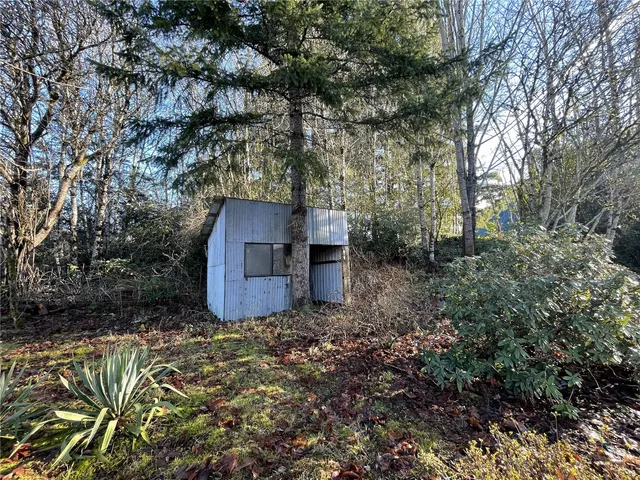 a house with trees in the background