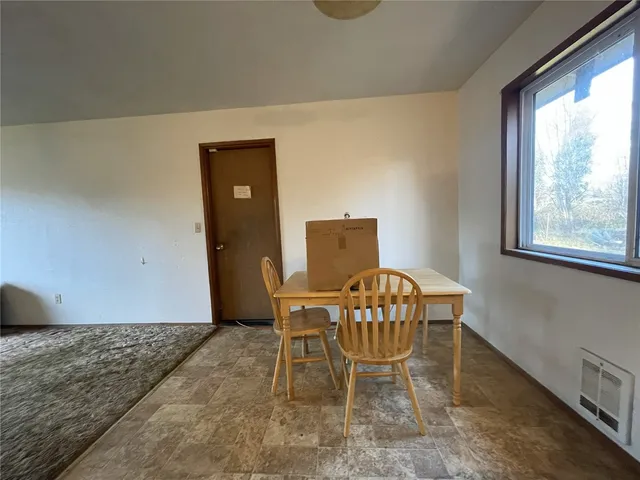 a workspace with furniture and window