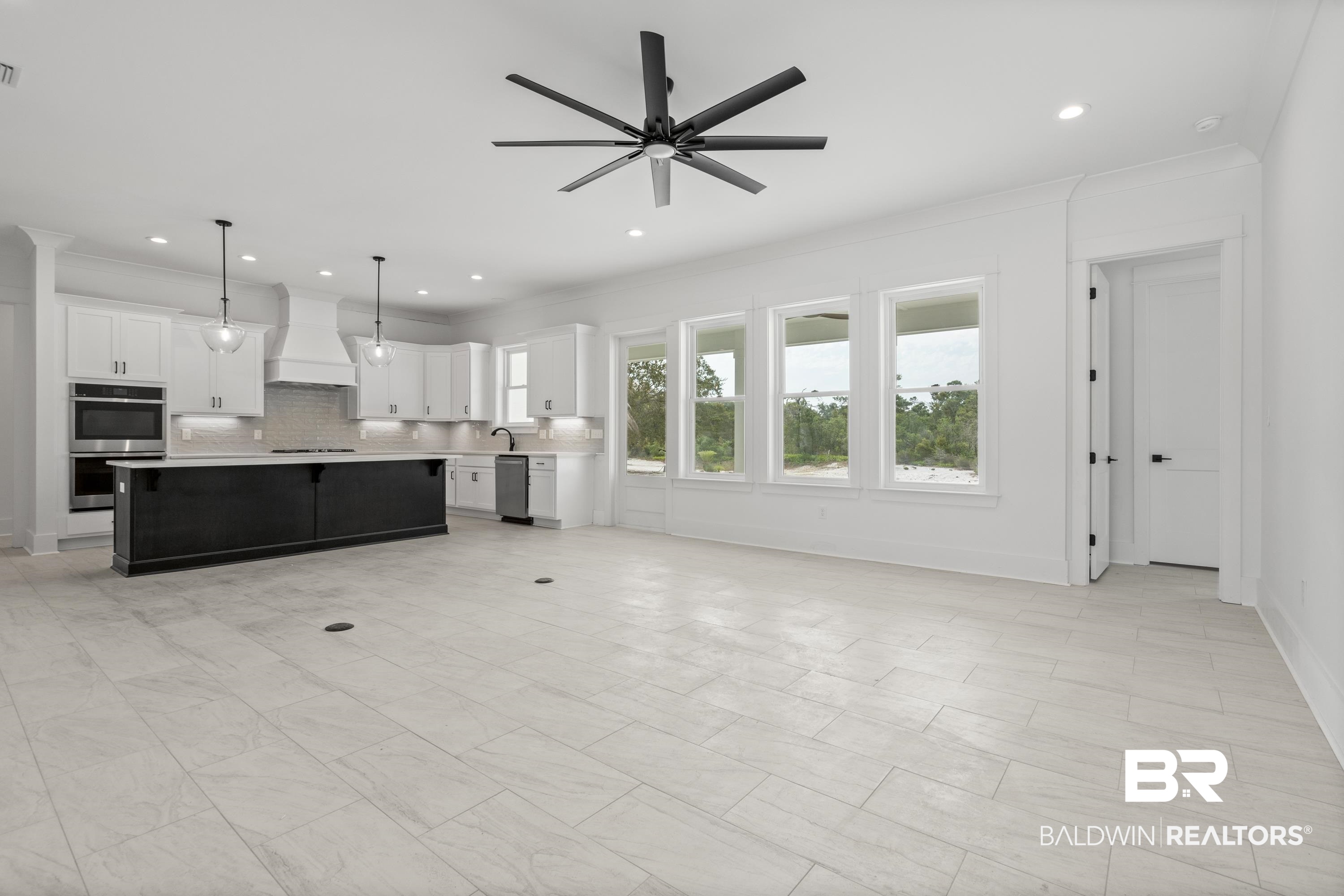 30650 Ono N Loop West Orange Beach, AL 36561 - Photo 4 of 38 Unfurnished living room featuring crown molding, ceiling fan, recessed lighting, and a sink