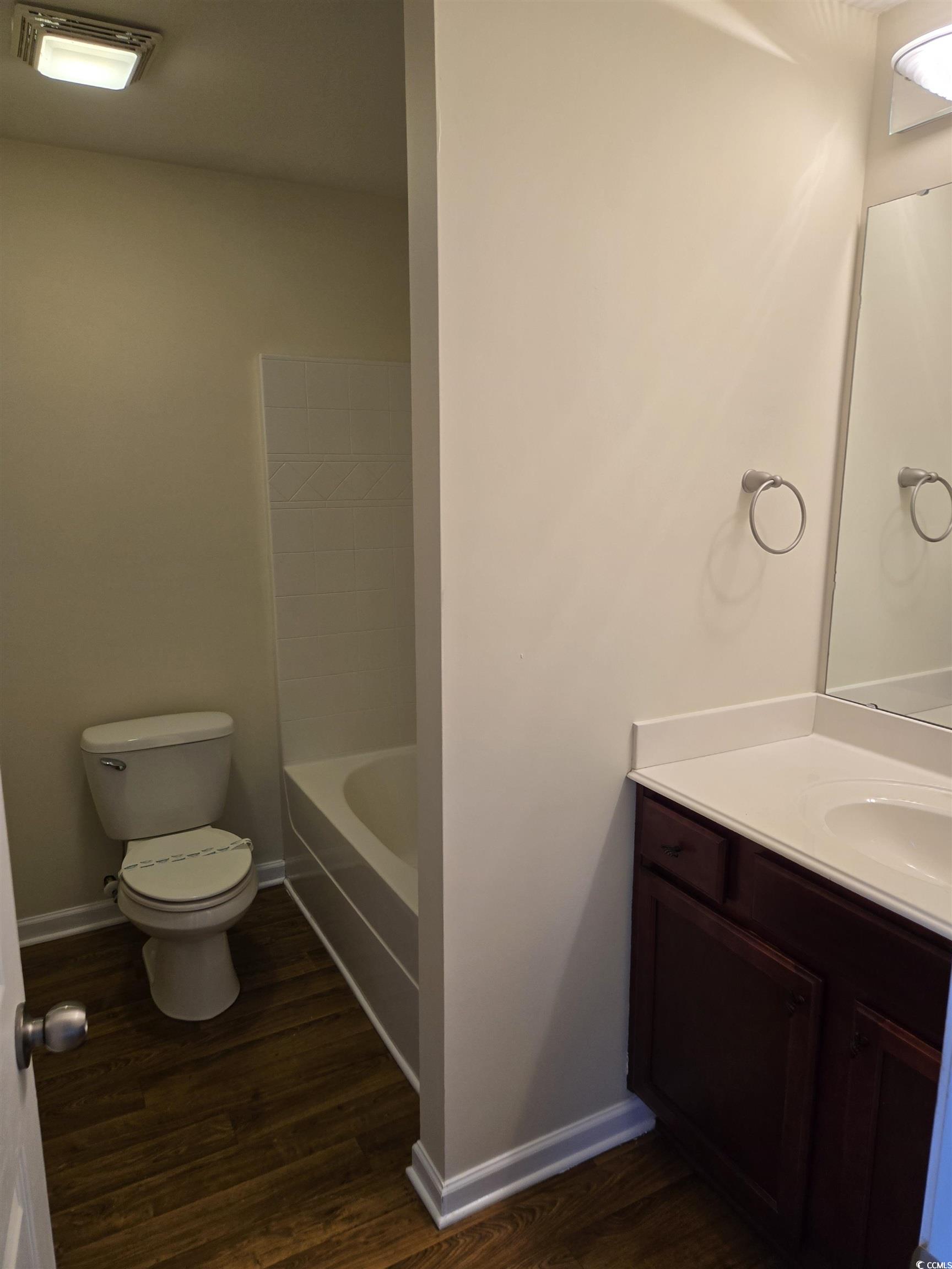 1245 Pine Ridge Street Conway, SC 29527 - Photo 14 of 28 Full bath featuring vanity, dark wood-style floors, and shower combination
