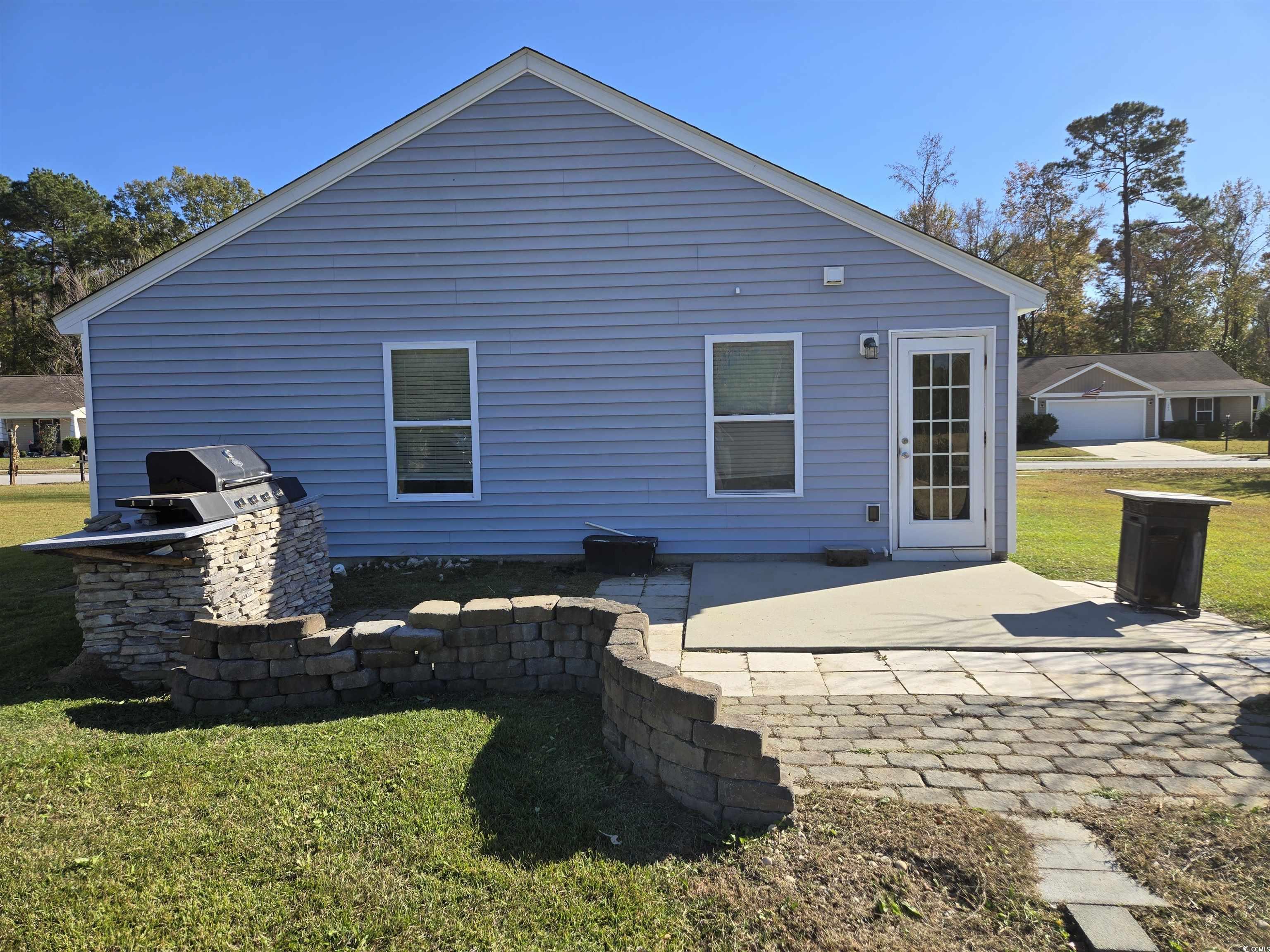 1245 Pine Ridge Street Conway, SC 29527 - Photo 19 of 28 Back of house featuring a yard and a patio area