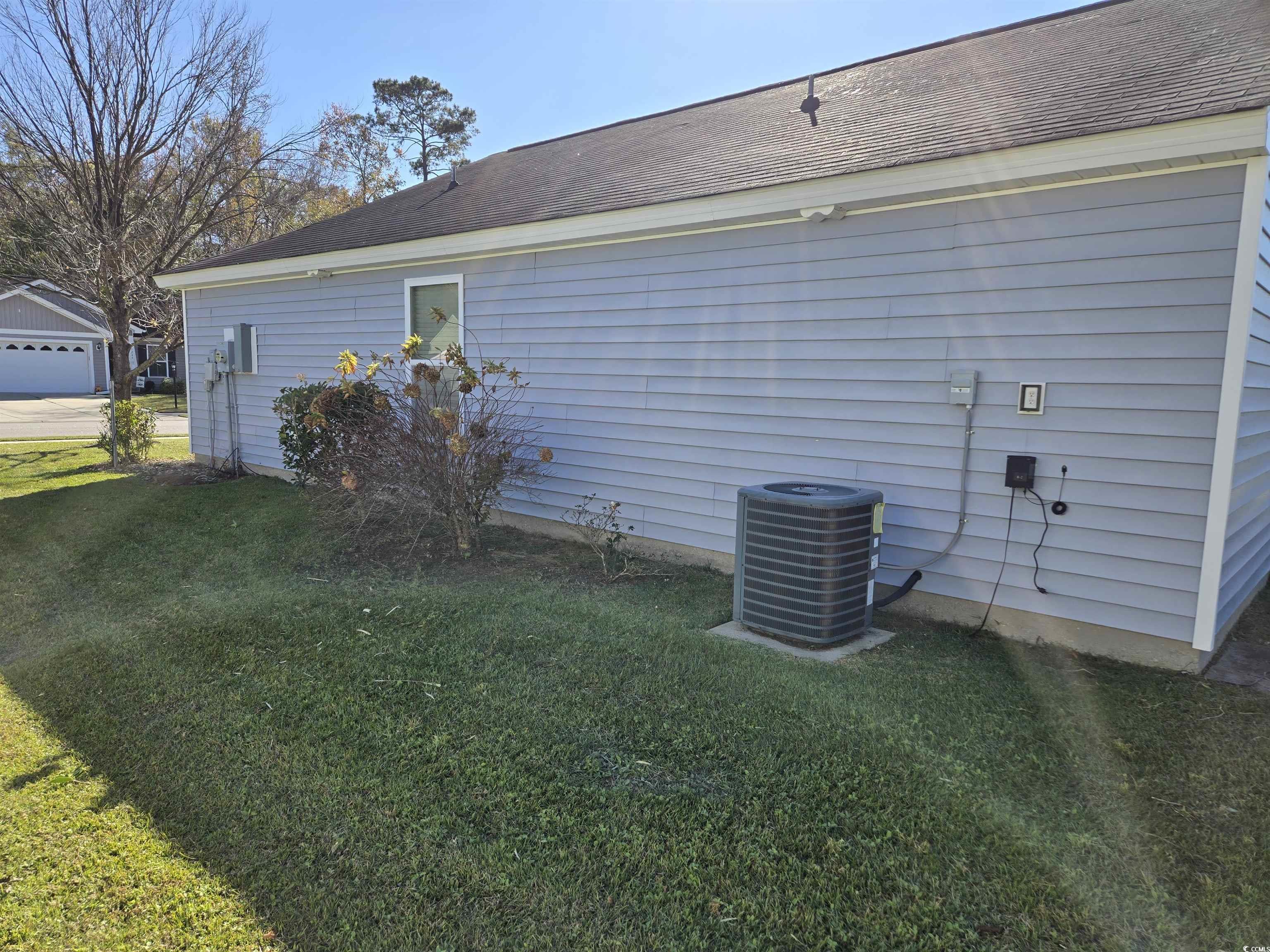 1245 Pine Ridge Street Conway, SC 29527 - Photo 21 of 28 View of side of home with a lawn and a shingled roof