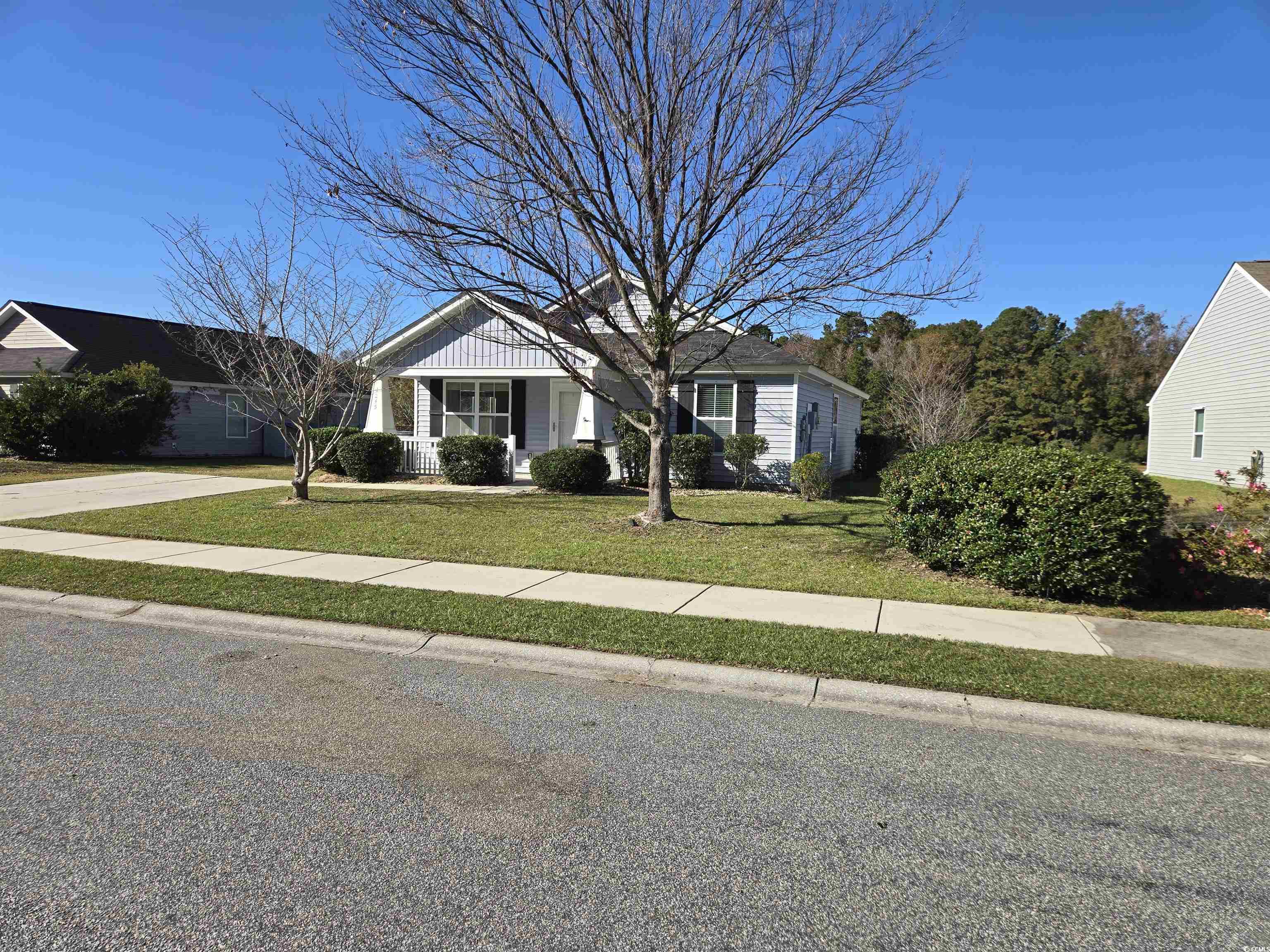 1245 Pine Ridge Street Conway, SC 29527 - Photo 24 of 28 View of front of house with a front lawn, board and batten siding, and a porch